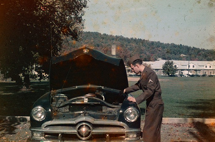Jack Wickland in dress uniform checking oil level, Fort Ritchie, 1957